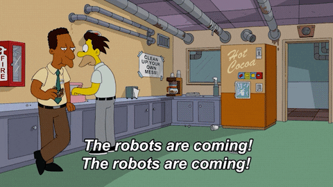 A man running up to two coworkers, yelling, "The robots are coming!"