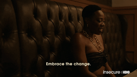 A woman releasing a breath and saying, "Embrace the change."