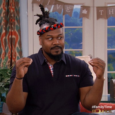 A man looking between his two hands.