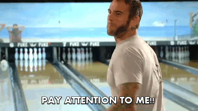 A man in a bowling alley screaming, "Pay attention to me!"
