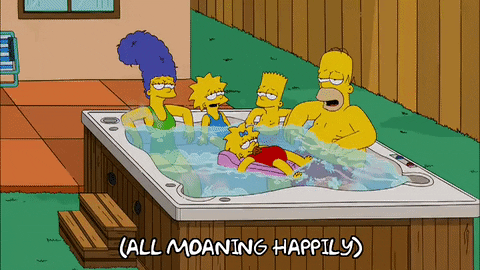 A family relaxing in a hot tub.
