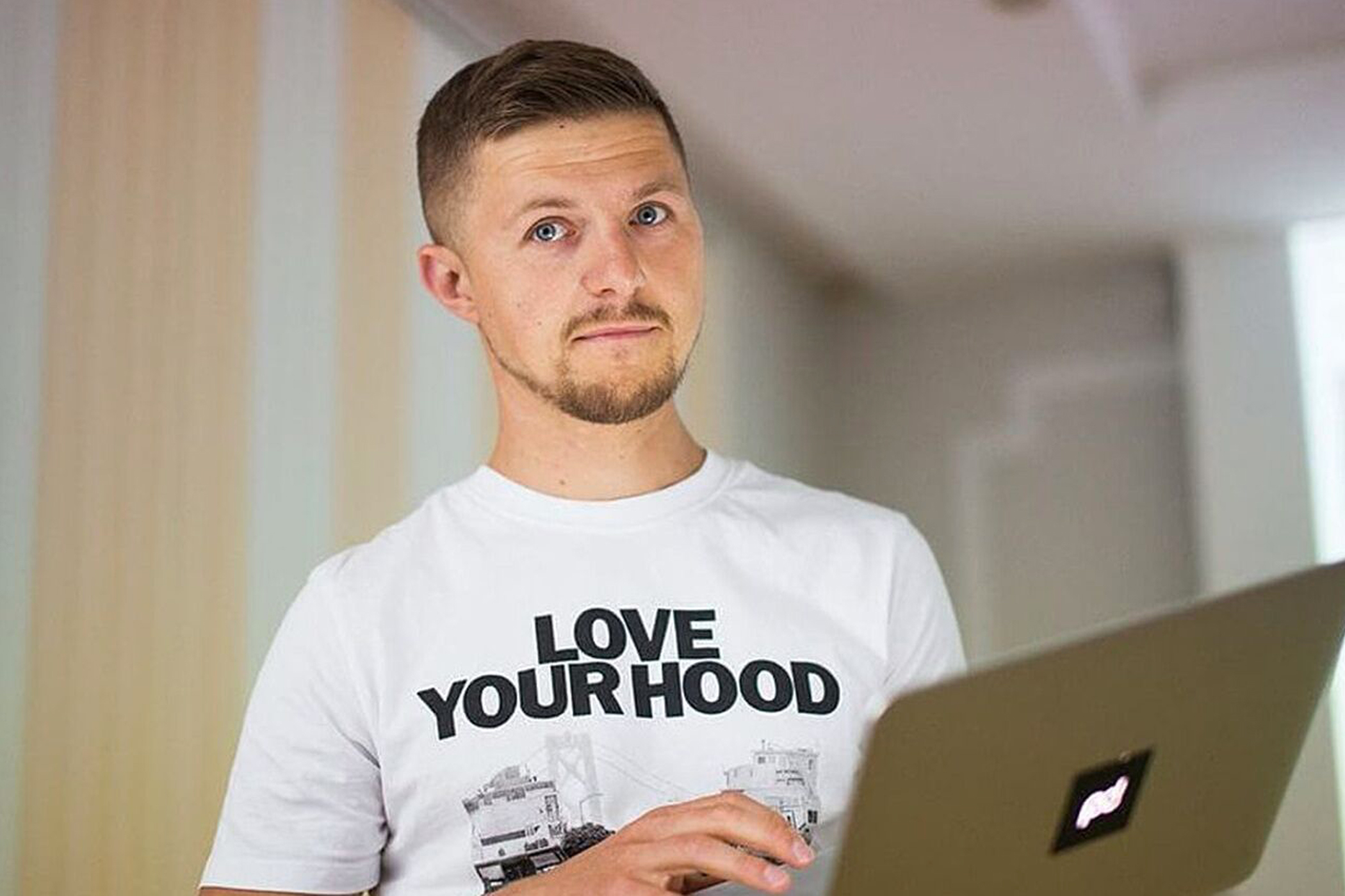 A man holding a laptop.